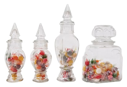COLLECTION OF 4 SMALL CLEAR GLASS CANDY JARS