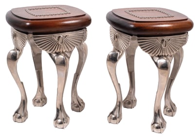 A PAIR OF EARLY CAST LEGGED STOOLS