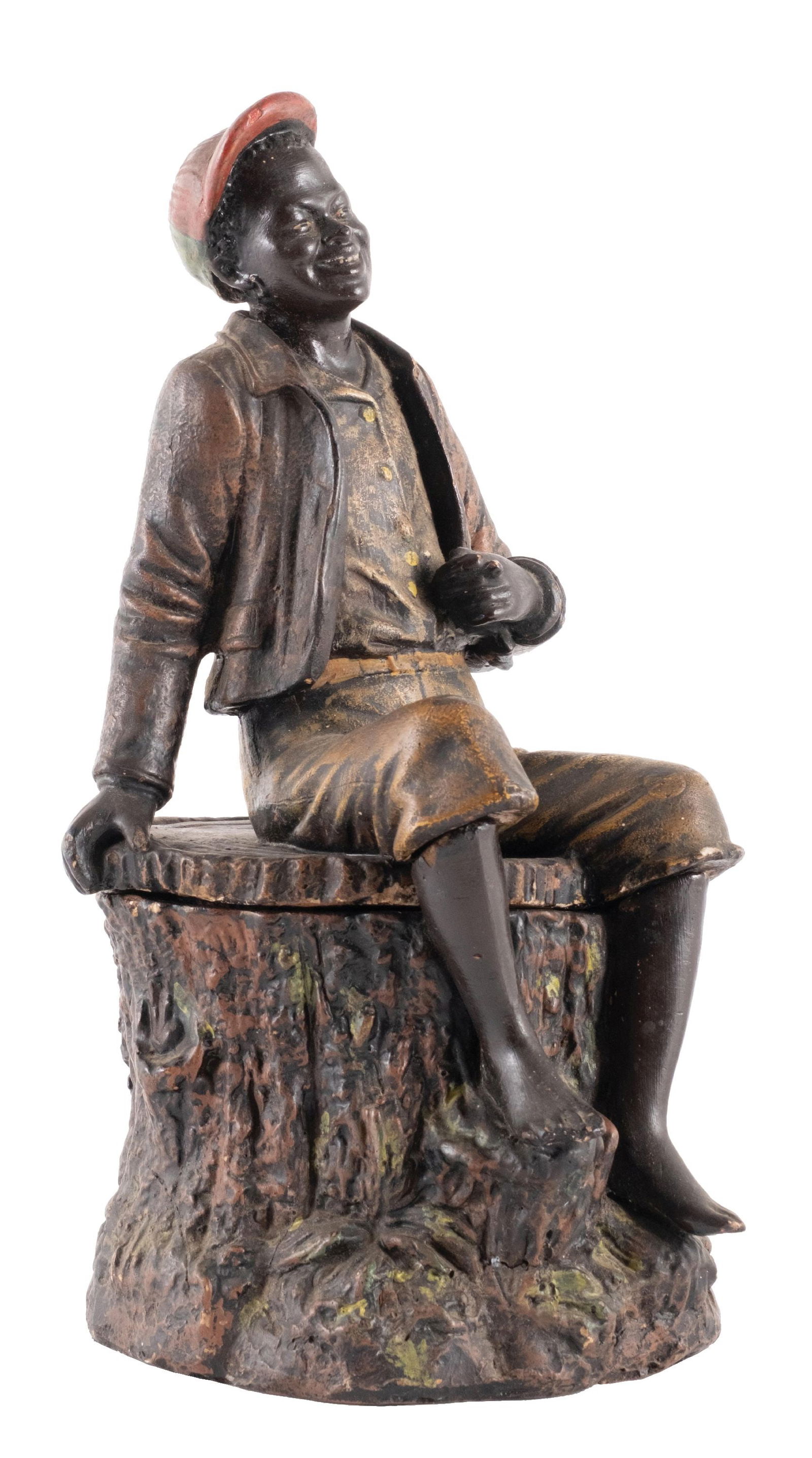 CERAMIC TOBACCO CANISTER: Marked for the Francis Statuary Company out of Worthington, Ohio. CONDITION: Ceramic construction, showing a gentleman sitting on a tree stump. There are areas of wear due to use, some light chipping