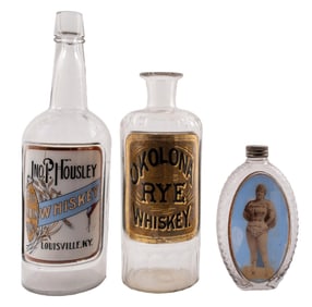 COLLECTION OF 3 PURPLE AND CLEAR GLASS ALCOHOL VINTAGE BOTTLES