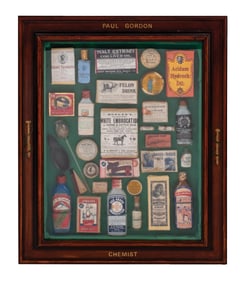 FRAMED SHADOW BOX "PAUL GORDON" WITH MULTIPLE ANTIQUE MEDICINES