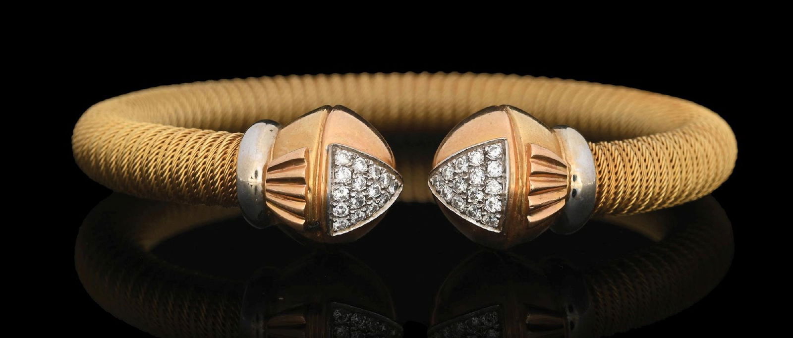 18K YELLOW & WHITE GOLD DIAMOND CUFF BRACELET: Ladies' 18k yellow and white gold flexible cuff bracelet mounted with 30 pave-set round cut diamonds. Gross weight is 40.2 grams. Marked "Chimento 750". Condition: (Very Good-Excellent). Dimensions: