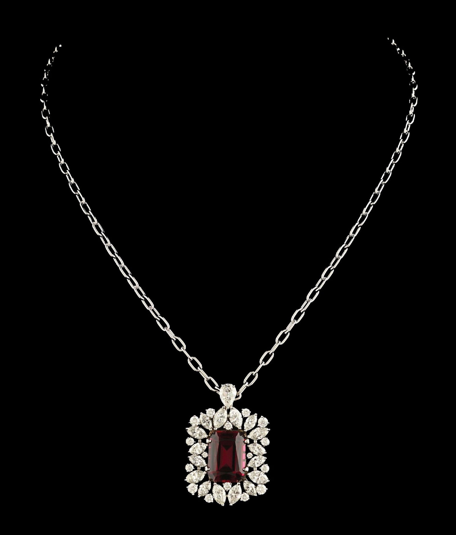 18K WHITE GOLD RED SPINEL & DIAMOND NECKLACE W/ APPRAISAL: Ladies' 18k white gold red spinel and diamond pendant and chain with extender. Set with 1 brilliant rectangular red spinel with cut-corners measuring approximately 10.5 x 14.5 x 6.5 mm and 33 mixed br