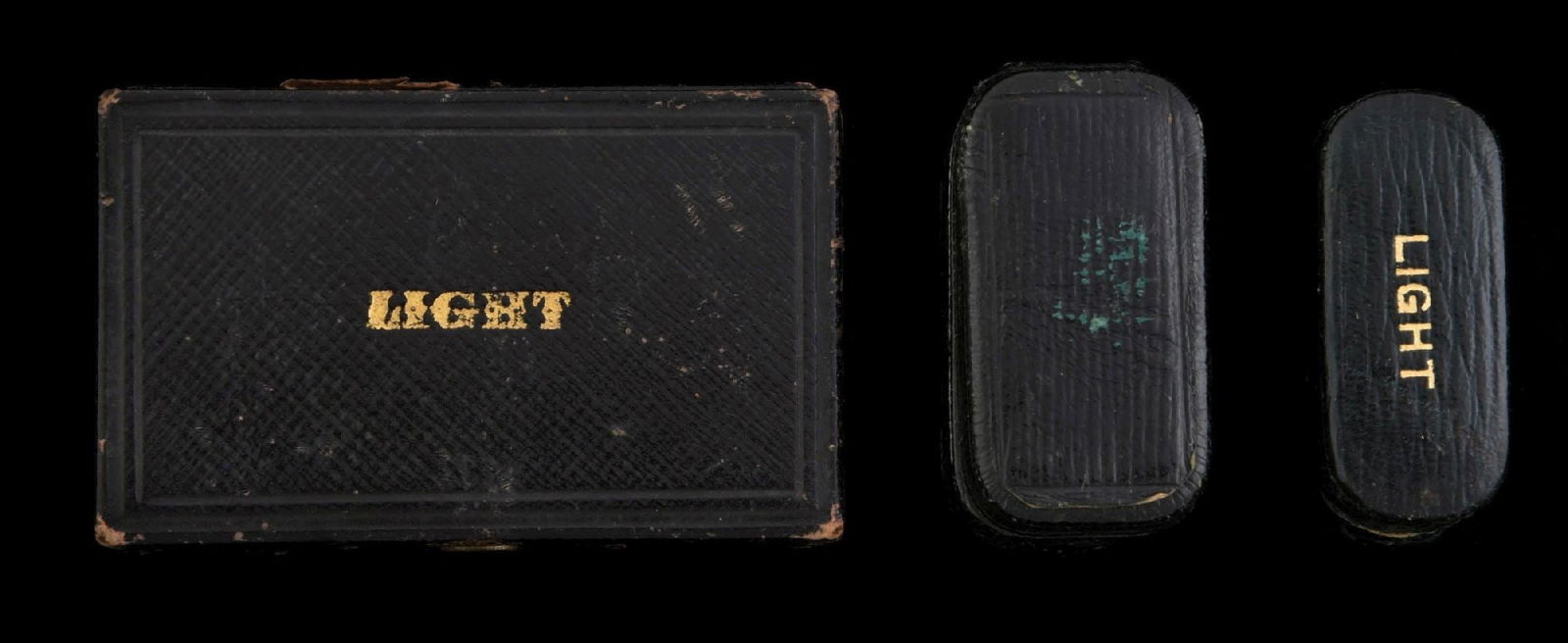 LOT OF 3: VINTAGE MATCH SAFES: Includes two match safes and compact. All with pressed cardboard exterior. Condition: (Excellent). Dimensions: Largest: 3" x 2" x 1".