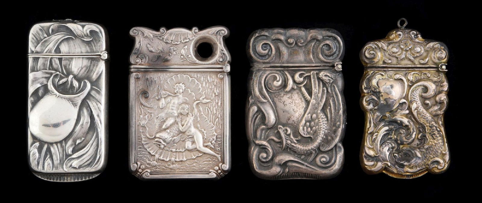LOT OF 4: STERLING SILVER MATCH SAFES: Includes brass safe with dragon, silver safe with dragon, Neptune and girl and a crop-related safe. Condition: (Excellent). Dimensions: Largest: 1 - 1/2" x 2 - 1/2".