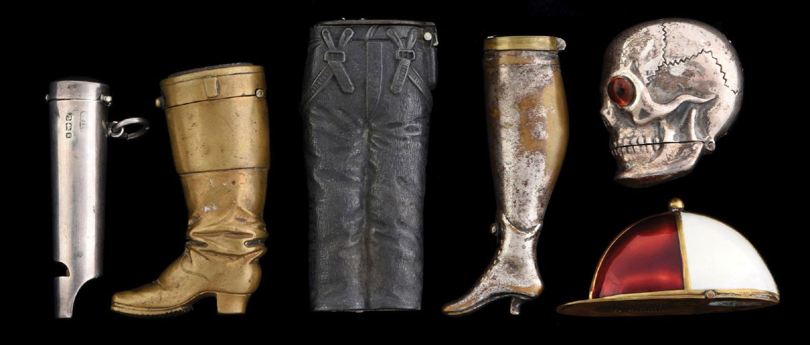 LOT OF 6: VINTAGE FIGURAL MATCH SAFES: Includes enameled derby hat, whistle, two boots, pair of jeans and skull. Condition: Dimensions: Largest: 1 - 1/4" x 3".