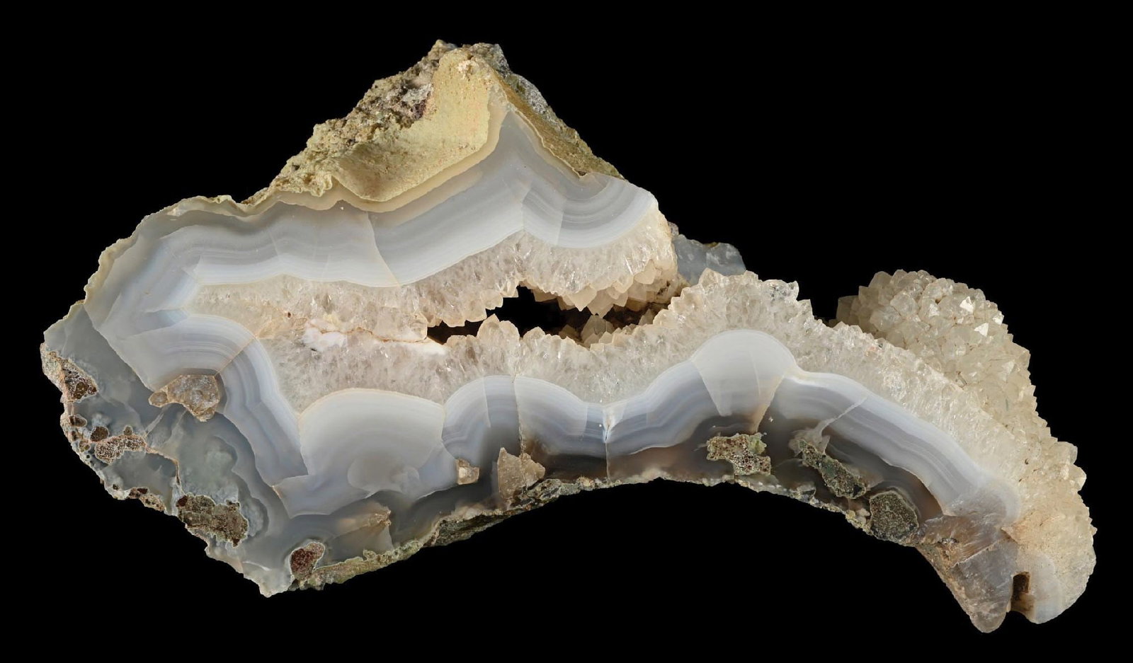 CRYSTALIZED PETRIFIED WOOD: Incredible details throughout, with beautiful coloring. Condition: (Excellent). Dimensions: 9 - 3/4” x 6” x 3 - 1/4”.
