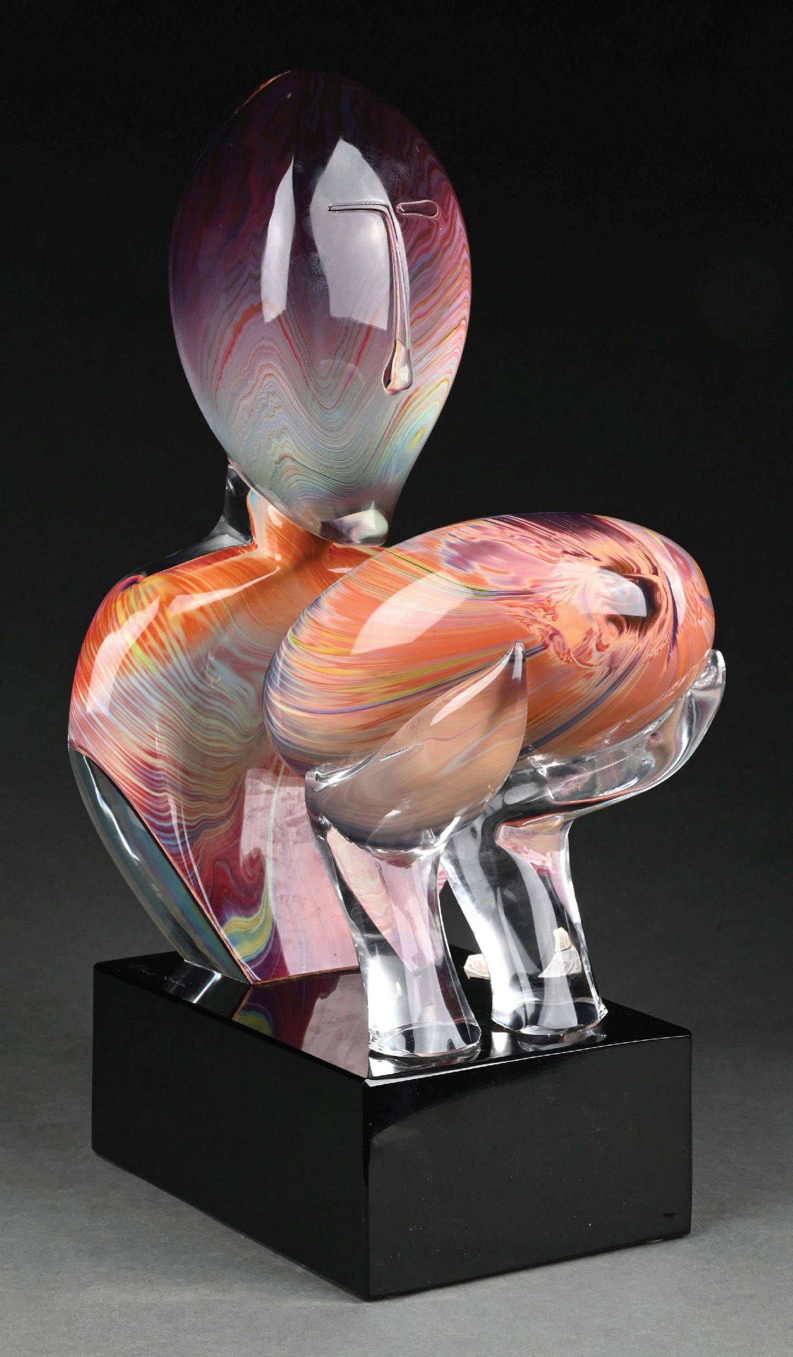 DINO ROSIN MURANO GLASS SCULPTURE "THE KISS": A beautiful example of "The Kiss" by Dino Rosin. The piece depicts two abstract faces in combination of clear glass and beautiful streaked multicolored glass in shades of purples, yellows, oranges, gr
