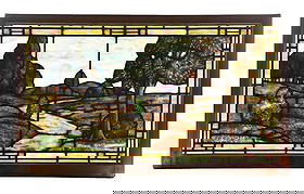 EARLY 20TH CENTURY AMERICAN LANDSCAPE STAINED GLASS WINDOW: A beautiful early American stained glass landscape window. The window in its frame measures 58" x 35". The window depicts a landscape scene with beautiful stained glass, painted trees and bushes in th