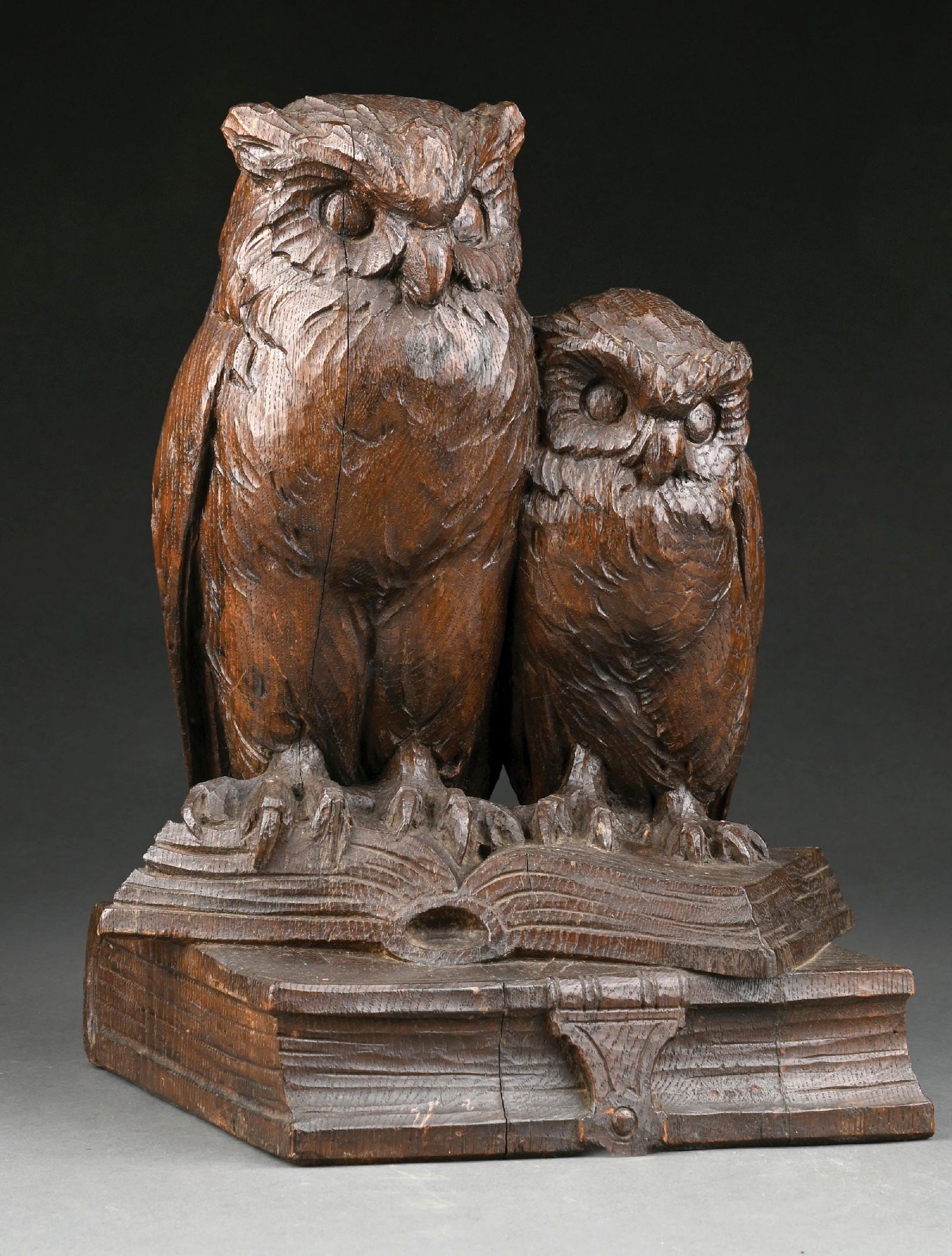 BLACK FOREST OWLS ON BOOKS FIGURE: Oak carved pair of knowledgeable owls. Condition: (Excellent). Dimensions: 10" x 9" x 15".