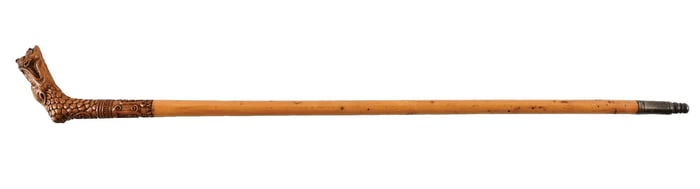 ANTIQUE WALKING STICK CANE WITH CARVED WOODEN CREATURE GRASPING THE HEAD OF A MAN