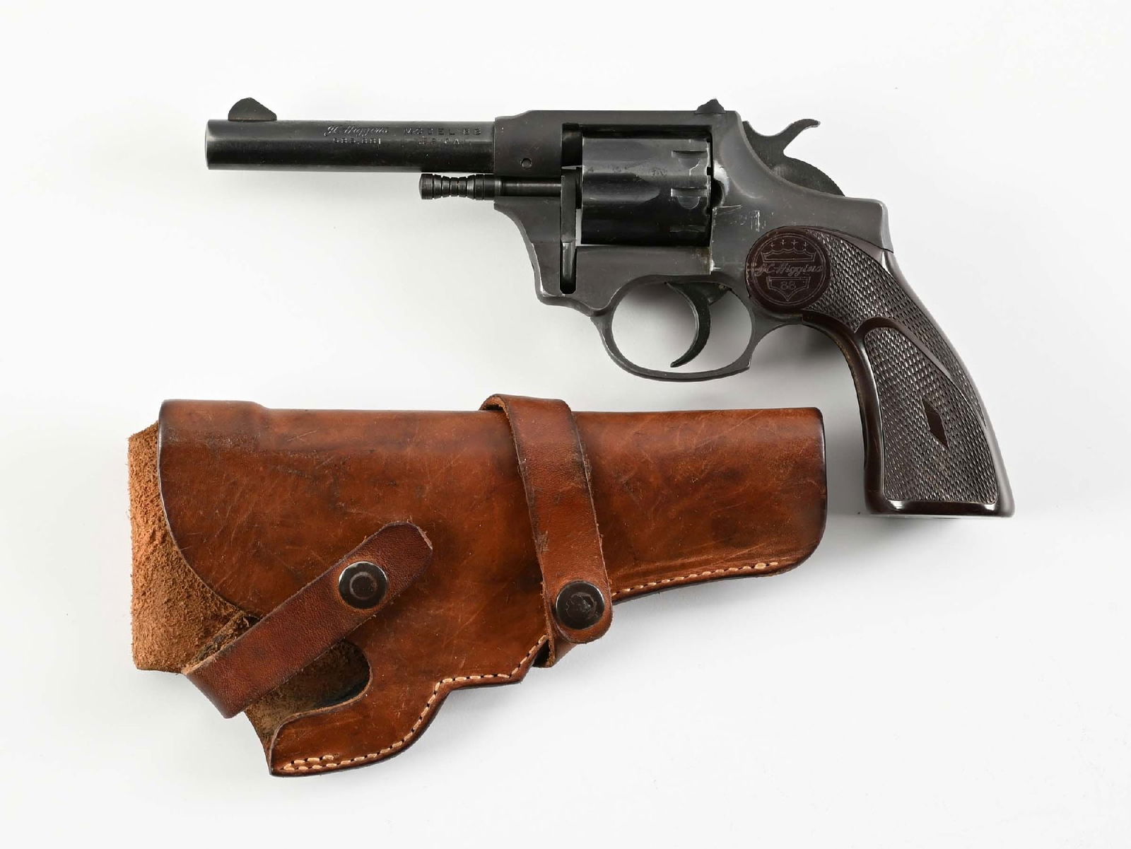 (C) J.C. HIGGINS MODEL 88 DOUBLE ACTION REVOLVER.: Made as the Sentinel beginning in the mid 1950s by Hi-Standard and retailed as the Higgins model through Sears stores. The matte black frame is made from aluminum with high polish blue fluted cylinder