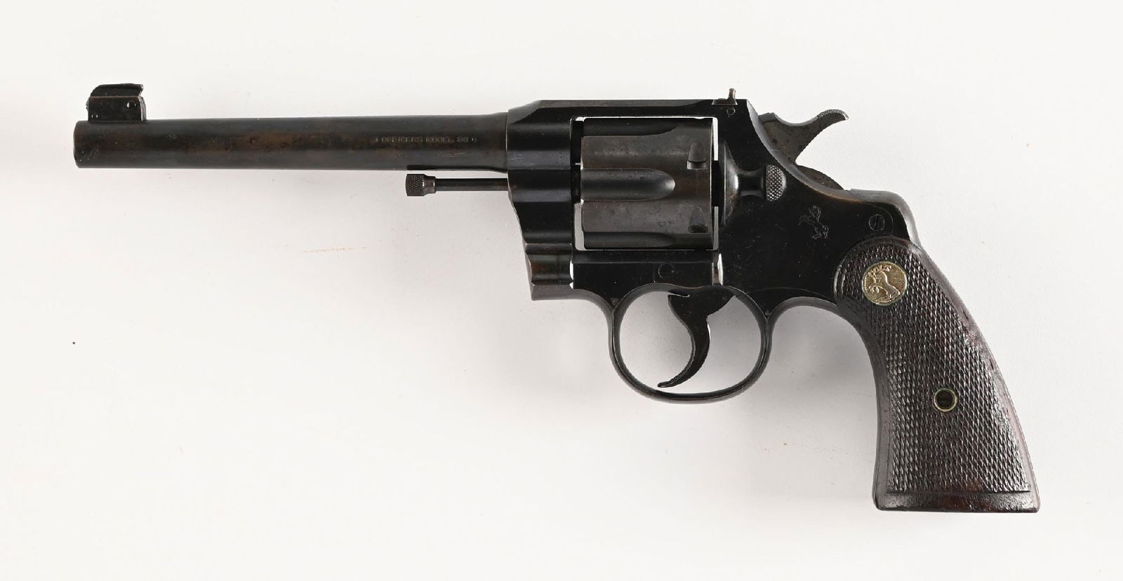 (C) FLAT TOP TARGET COLT OFFICERS MODEL .38 DOUBLE ACTION REVOLVER.: Dates to 1927. This flat top target features the target adjustable front sight, adjustable rear sight. A checkered trigger and back strap, blue finish, silver medallion checkered walnut grips. CONDITI