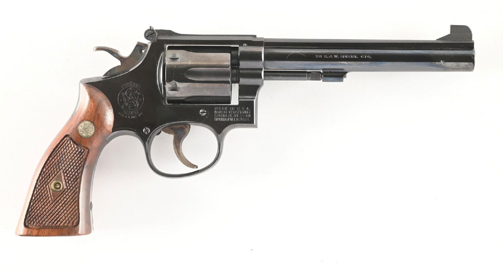 (C) SMITH & WESSON MODEL 14-2 K-38 MASTERPIECE DOUBLE ACTION REVOLVER WITH BOX.: Dates to 1963. Built on the square butt, K-frame, 3-screw with pinned barrel, blue finish, case color hammer and trigger, adjustable target rear sight and walnut checkered magna grips with silver meda