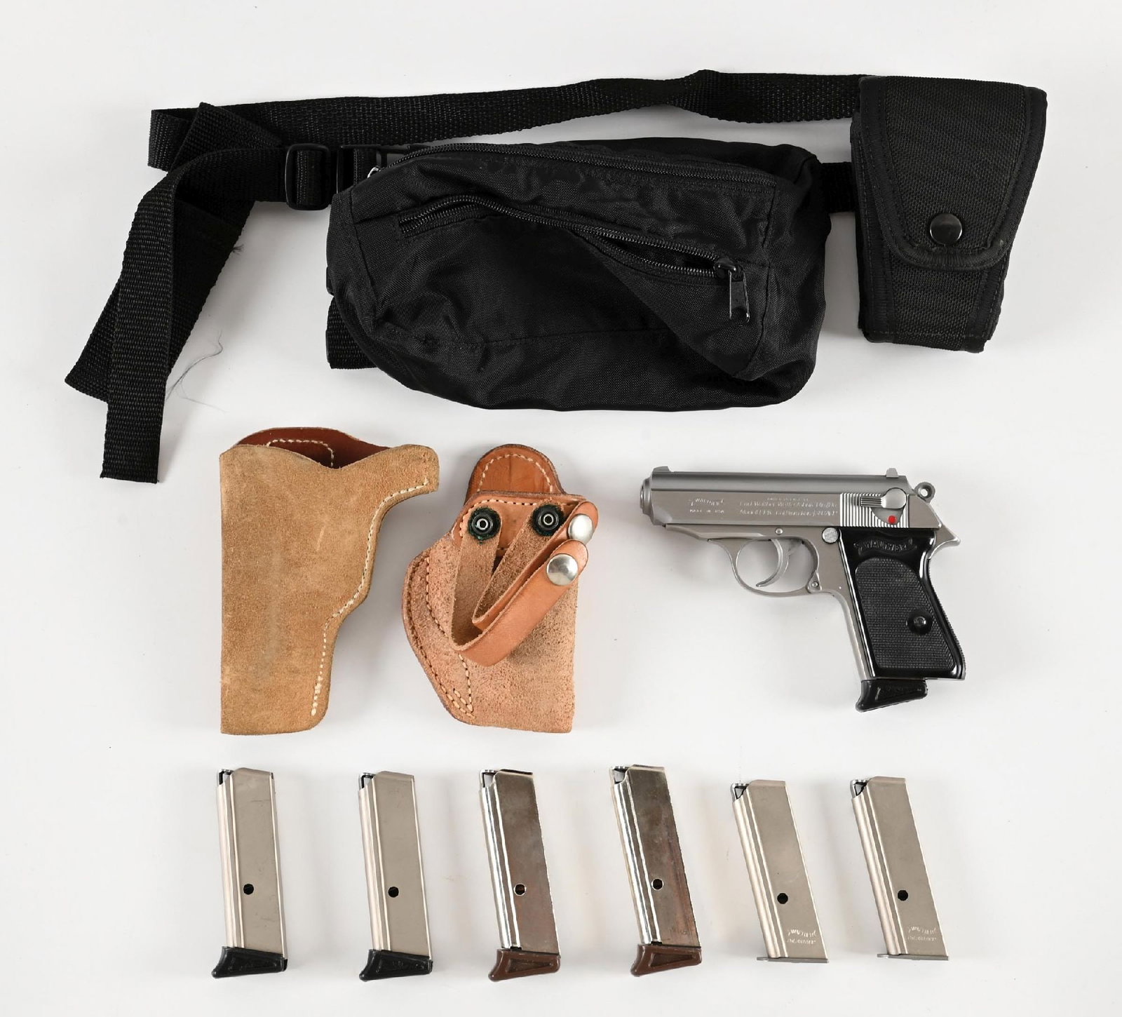 (M) WALTHER INTERARMS USA STAINLESS PPK SEMI-AUTOMATIC PISTOL.: Features the dual tone stainless finish, a matted slide, wind drift red line rear sight, light weight hammer, Walther banner black grips and comes with seven magazines, three of which are marked Walth
