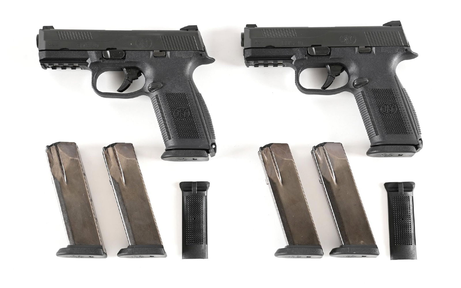 (M) LOT OF 2: FNH FNS-40 SEMI-AUTOMATIC PISTOLS.: Lot consists of: 2 identically configured striker fired pistols with 3-dot sights, matte finished slides, and textured polymer frames. Pistols are both housed in their factory hard cases and include 3