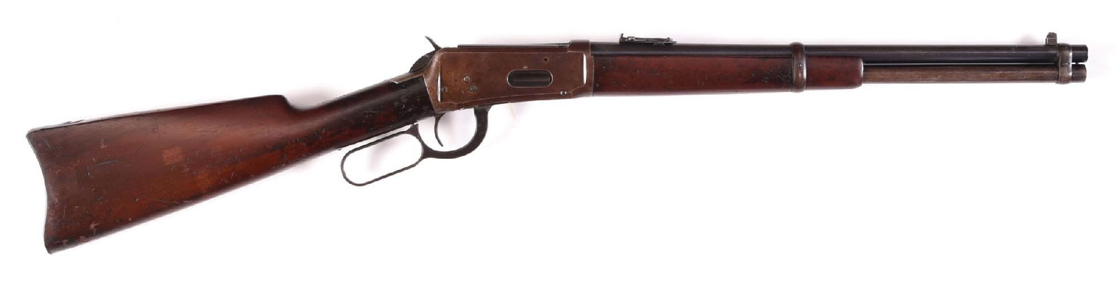 (C) WINCHESTER MODEL 1894 LEVER ACTION SADDLE RING CARBINE IN 25-35 CALIBER.: Dates to 1915. Standard saddle ring carbine features the blue finish, post and pinned front sight, folding ladder rear sight, walnut stock with metal carbine butt plate and matching forearm. The barre