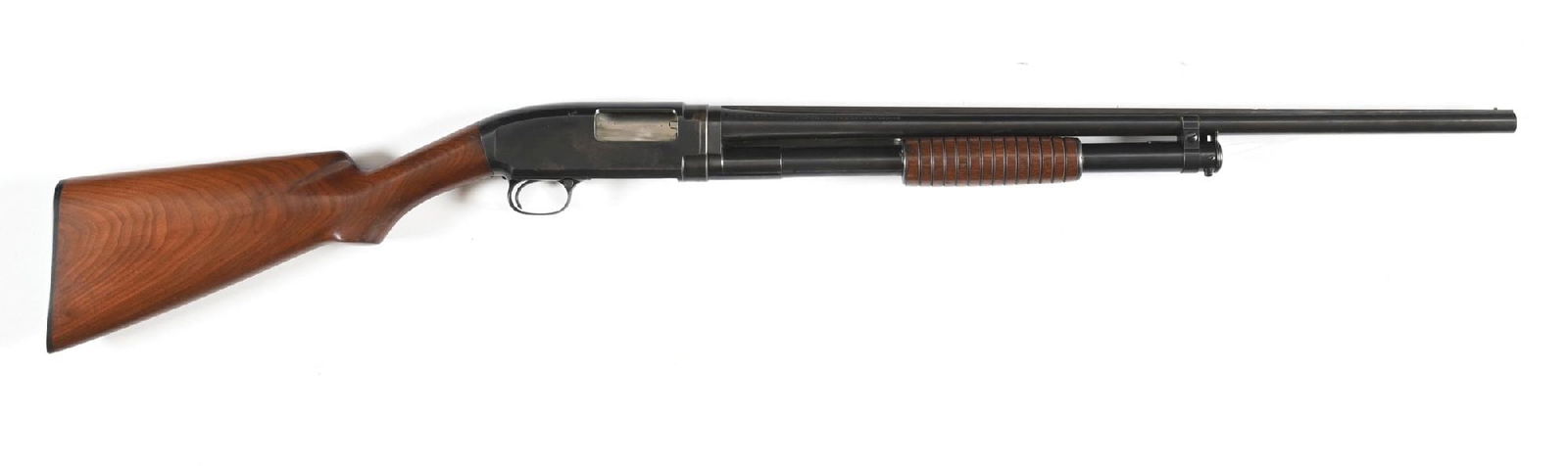 (C) 2ND YEAR WINCHESTER MODEL 1912 20 GAUGE SLIDE ACTION SHOTGUN WITH SOLID RIB.: Dates to 1913. Features the factory blue finish, matted solid rib, single bead front sight, take down, walnut stock with plain pistol grip, the black Winchester butt plate and small round bottom groov