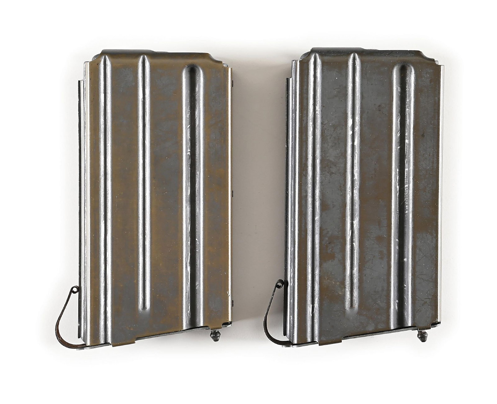 VERY RARE SET OF TWO 20 ROUND EARLY PRE-PRODUCTION CIRCLE 1 "PIGGYBACK" M-16 MAGAZINES.: Named for the logo found on the lower left side of each magazine, These are incredibly scarce and highly sought after collector’s items for advanced early AR-15/M-16 collectors. Very few of thes