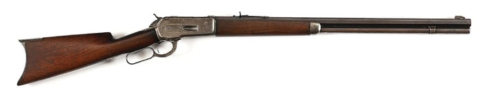 (A) WINCHESTER MODEL 1886 LEVER ACTION RIFLE.