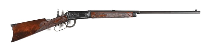 (C) HANDSOME ENGRAVED WINCHESTER MODEL 1894 LEVER ACTION RIFLE WITH CARVED STOCKS.