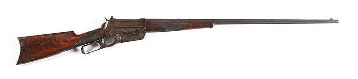 (C) DELUXE WINCHESTER MODEL 1895 LEVER ACTION RIFLE IN .38-72 WITH OCTAGONAL BARREL.