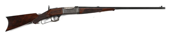 (C) FACTORY ENGRAVED "D" VICTOR GRADE SAVAGE MODEL 1899 TAKEDOWN LEVER ACTION RIFLE IN .303 SAVAGE.