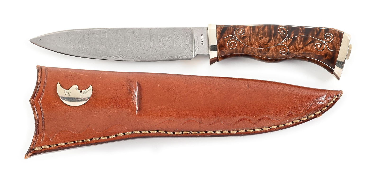 RARE WILLIAM F. "BILL" MORAN DAMASCUS HUNTER.: By 1973, when he reinvented Damascus steel, W.F. "Bill" Moran Jr. had already been handcrafting knives for 25 years. His ability to craft high end custom made knives earned him a reputation as one of