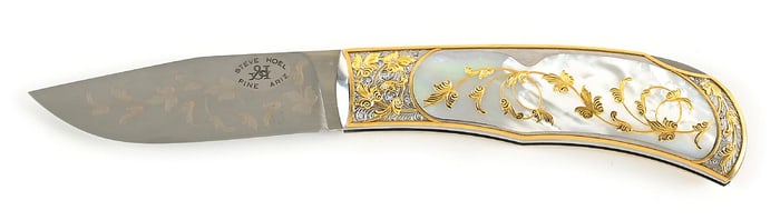 STEVE HOEL SMALL PEARL AND GOLD FOLDER EMBELLISHED BY BARRY LEE HANDS.
