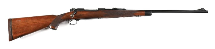 (C) PRE-64 SUPER GRADE WINCHESTER MODEL 70 BOLT ACTION RIFLE IN .257 ROBERTS (1951).