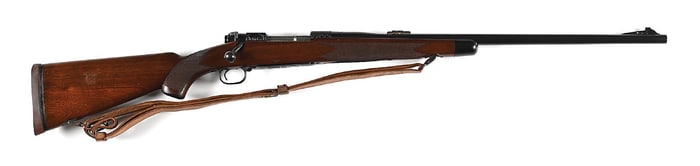 (C) ENGRAVED PRE-64 WINCHESTER MODEL 70 BOLT ACTION RIFLE IN .375 MAGNUM (1950).