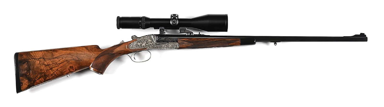 (M) BEAUTIFULLY ENGRAVED HEYM 44B SINGLE SHOT STALKING RIFLE IN .30-06.: Manufactured in Germany in 2003. The tapered octagon barrel is finished in high polished blue and has deeply cut oak leaf engraving at the breech. Ramped blade front sight and rib mounted square notch