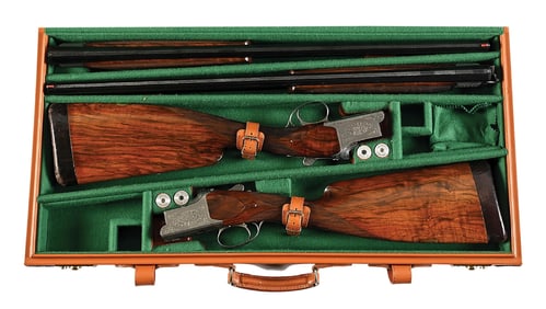(M) PAIR OF CAMPAGNOLO ENGRAVED FNH B25 SUPERPOSED SHOTGUNS.