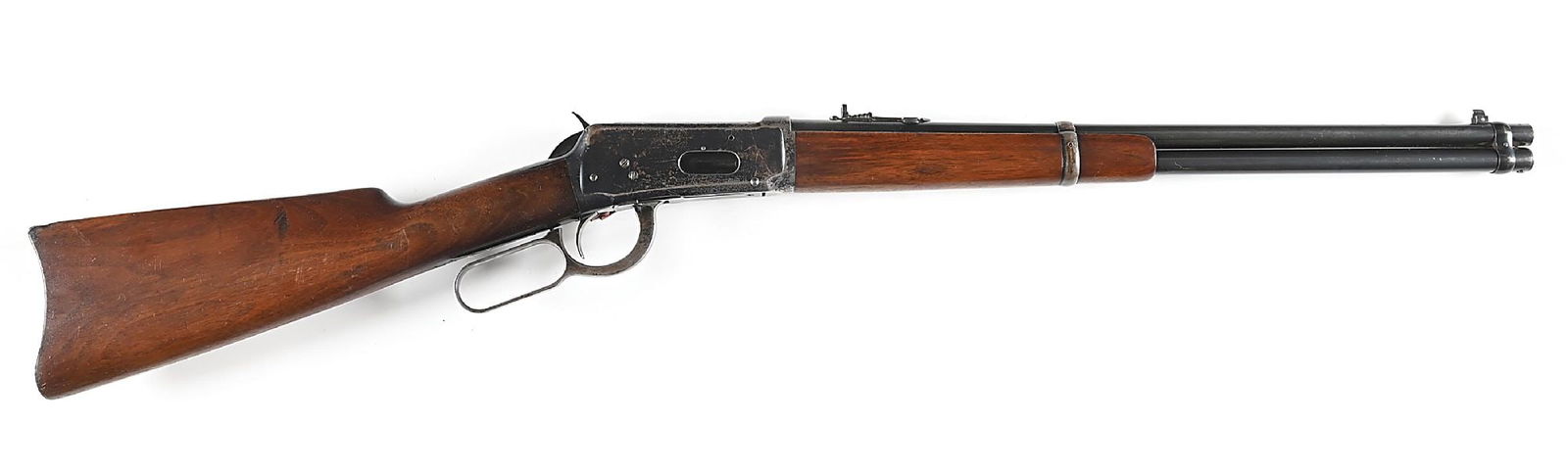 (C) WINCHESTER MODEL 1894 LEVER ACTION SADDLE RING CARBINE.: Circa 1928. Blued nickel steel barrel with pinned blade front sight and Marbles sporting rear. Solid frame with saddle ring. Long nose carbine forend retained by a barrel band. Plain walnut stock with