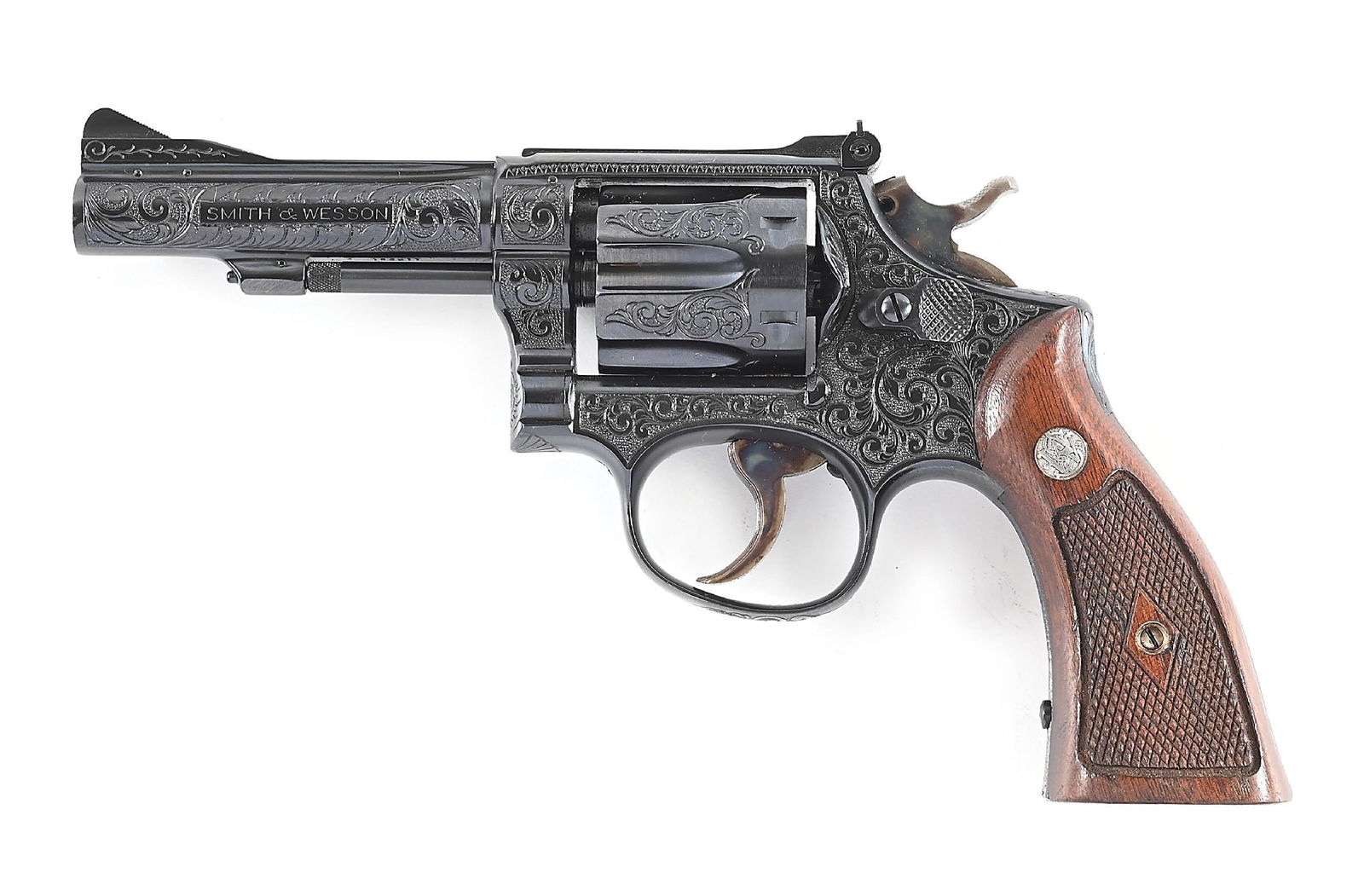 (C) ENGRAVED SMITH & WESSON PRE MODEL 15 K-38 COMBAT MASTERPIECE DOUBLE ACTION REVOLVER.: The factory letter states that this gun was shipped on January 30, 1953 to Rex Firearms in NYC with a ramp front sight, 4" barrel and checkered walnut grips. Built on the square butt K-frame, 5-screw,