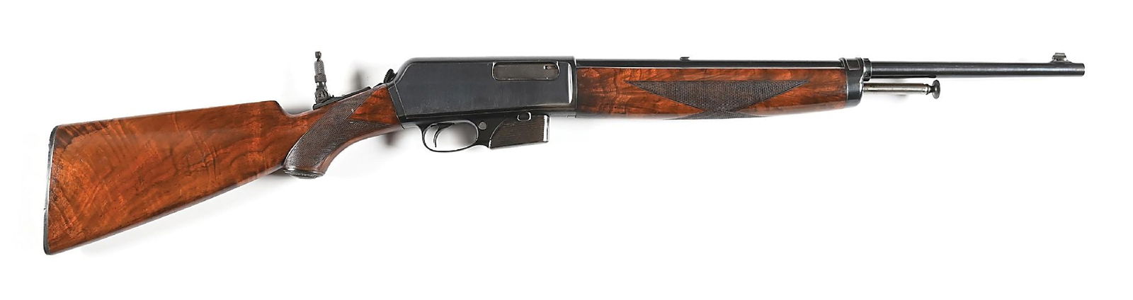 (C) FINE DELUXE WINCHESTER MODEL 1910 SELF LOADING RIFLE.: Manufactured circa 1925. Blued nickel steel barrel with Lyman bead top blade front sight and rear dovetail filled in with a blank, the tang fitted with a rear aperture sight. Deluxe checkered forend a