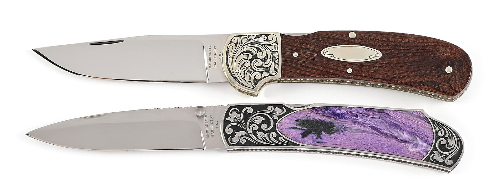LOT OF 2: HARVEY MCBURNETTE ENGRAVED LOCKBACK FOLDERS.: Lot consists of: (A) Mirror polished drop point blade with nail nick assist. Blade is marked "McBURNETTE / EAGLE NEST / N.M." on obverse ricasso. Silvered frame exhibits neatly fileworked borders. Eng