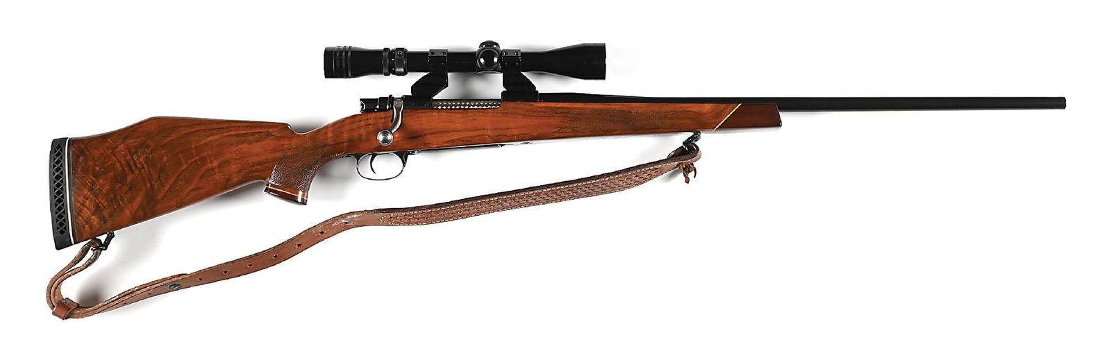 (C) FN ACTION WEATHERBY BOLT ACTION RIFLE IN .300 WEATHERYBY MAGNUM.: The FN actions were used on Weatherby rifles beginning in 1949. This rifle was built circa 1954. The ninth edition Weatherby catalog for 1956-57 still shows the FN action while the 1958 introduces the