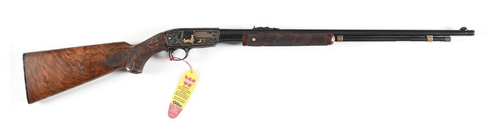 (C) ENGRAVED AND GOLD INLAID WINCHESTER MODEL 61 SLIDE ACTION RIFLE IN .22 MAGNUM WITH CARVED