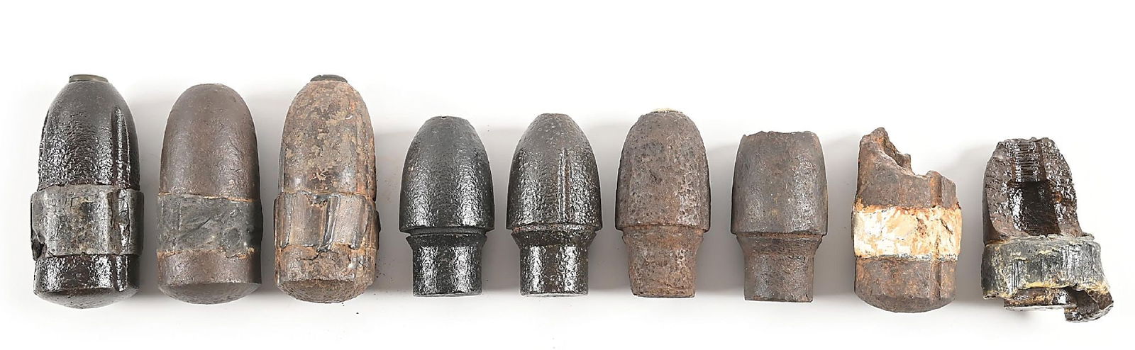 LOT OF 9: CIVIL WAR US HOTCHKISS SHELLS AND FRAGMENTS.: Lot consists of: (A) US three inch Hotchkiss shell with paper label that notes Fredericksburg, Virginia as the dig location. (B) US three inch Hotchkiss shell with paper label that notes Cedar Creek,