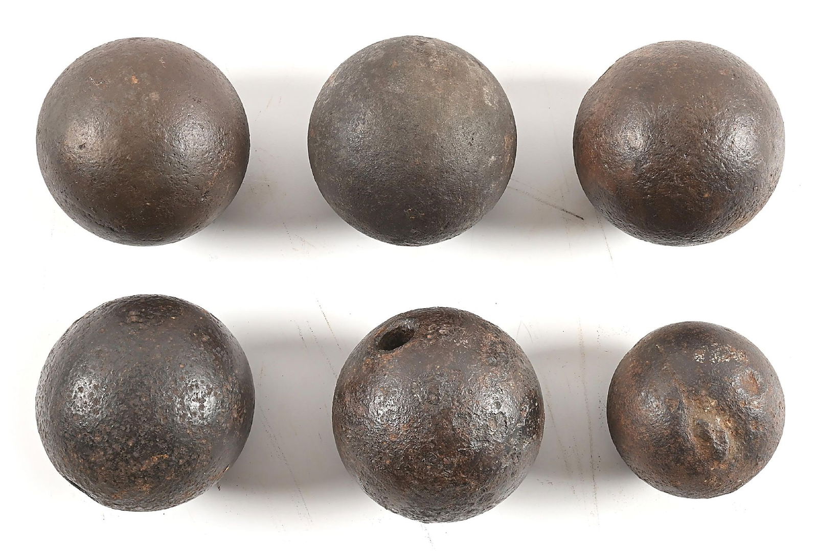 LOT OF 6: FRENCH AND INDIAN WAR CANNONBALLS.: Lot consists of: (A) British 12 pound solid shot with paper tag that states it was dug at Camp Dunbar during the 1950s. (B) British 12 pound solid shot with paper tag that states it was dug at Camp Du