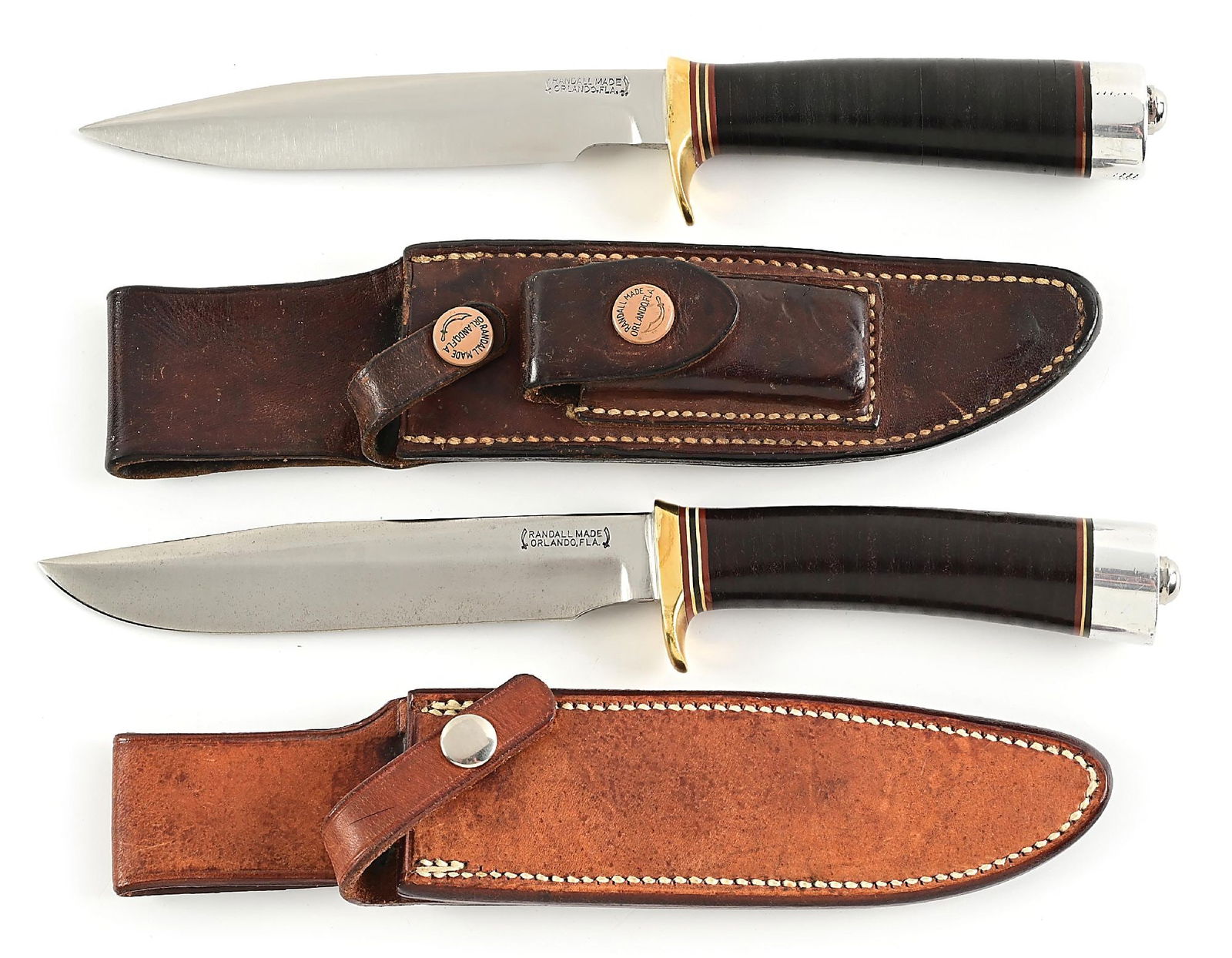 LOT OF 2: EARLY RANDALL MODEL 5 CAMP AND TRAIL KNIVES.: Lot consists of: (A) In November 1943, Bo Randall decided to redesign one of his Scagel-style hunters so it could use the same hilt, handle, and pommel as his popular Model 1 Fighter. Due to the new c