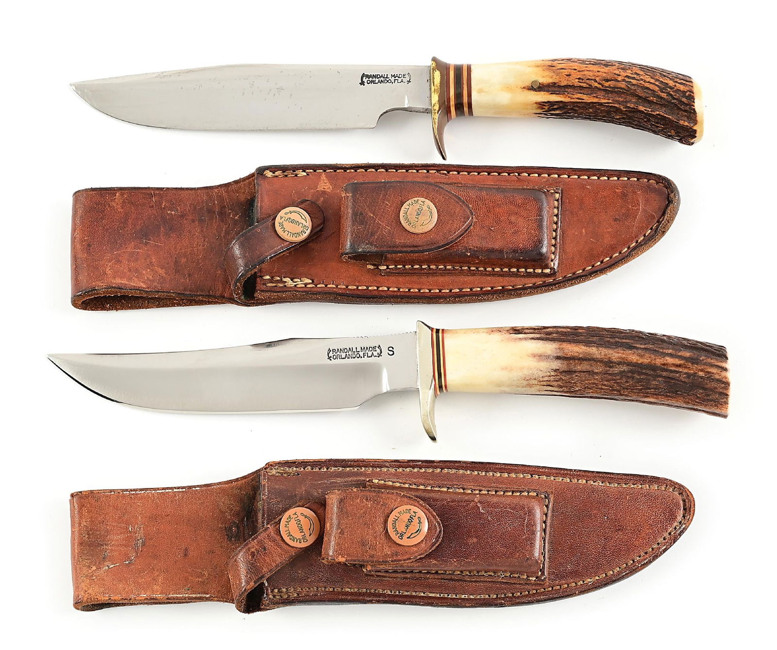 LOT OF 2: RANDALL MODEL 5 CAMP AND TRAIL KNIFE AND MODEL 12 LITTLE BEAR BOWIE.: Lot consists of: (A) In November 1943, Bo Randall decided to redesign one of his Scagel-style hunters so it could use the same hilt, handle, and pommel as his popular Model 1 Fighter. Due to the new c