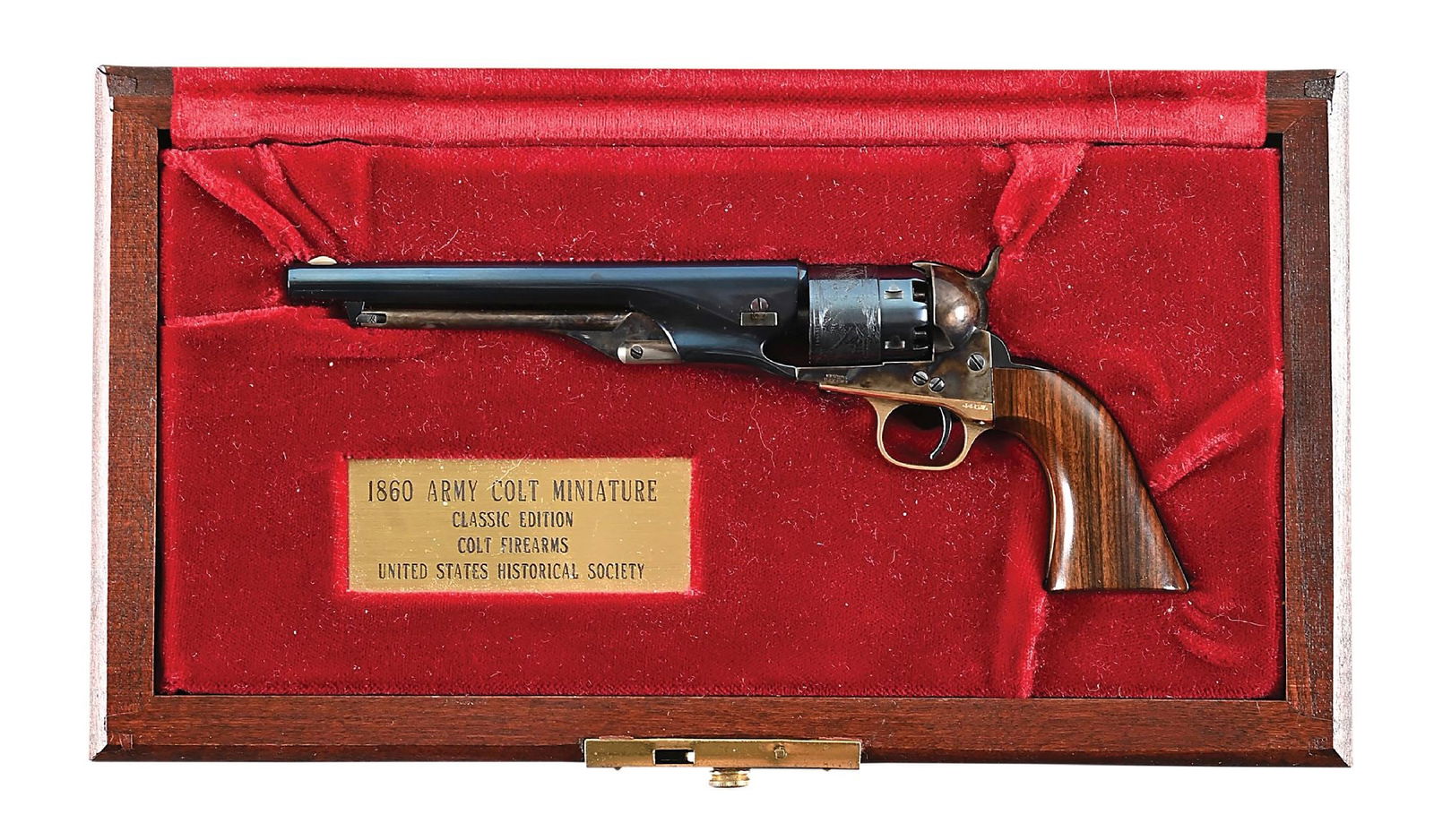 CLASSIC EDITION CASED MINIATURE COLT 1860 ARMY SINGLE ACTION REVOLVER: The enclosed Marty Huber Colt letter states that this gun, number 86, was shipped to the U.S. HISTORICAL SOCIETY, part of the Colt Miniature collection, in 1987. The other Colt certificate states it a