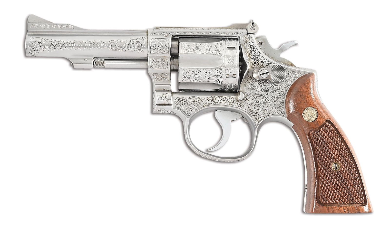 (C) ENGRAVED SMITH AND WESSON MODEL 67 DOUBLE ACTION REVOLVER.: The factory letter states that this gun was shipped on August 26 1974 to Western Auto of Maryland as a standard gun. The engraving was done outside the factory. Introduced in 1972 as the .38 Combat Ma