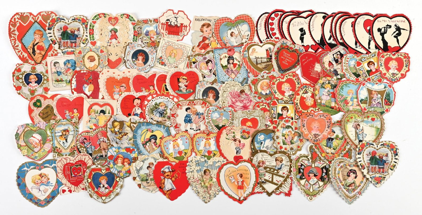 LARGE LOT OF: VINTAGE DIE CUT VALENTINE HEARTS CARDS: LARGE LOT OF: VINTAGE DIE CUT VALENTINE HEARTS CARDS Condition: (Excellent) Dimensions: Largest: 6 - 1/4" x 5".