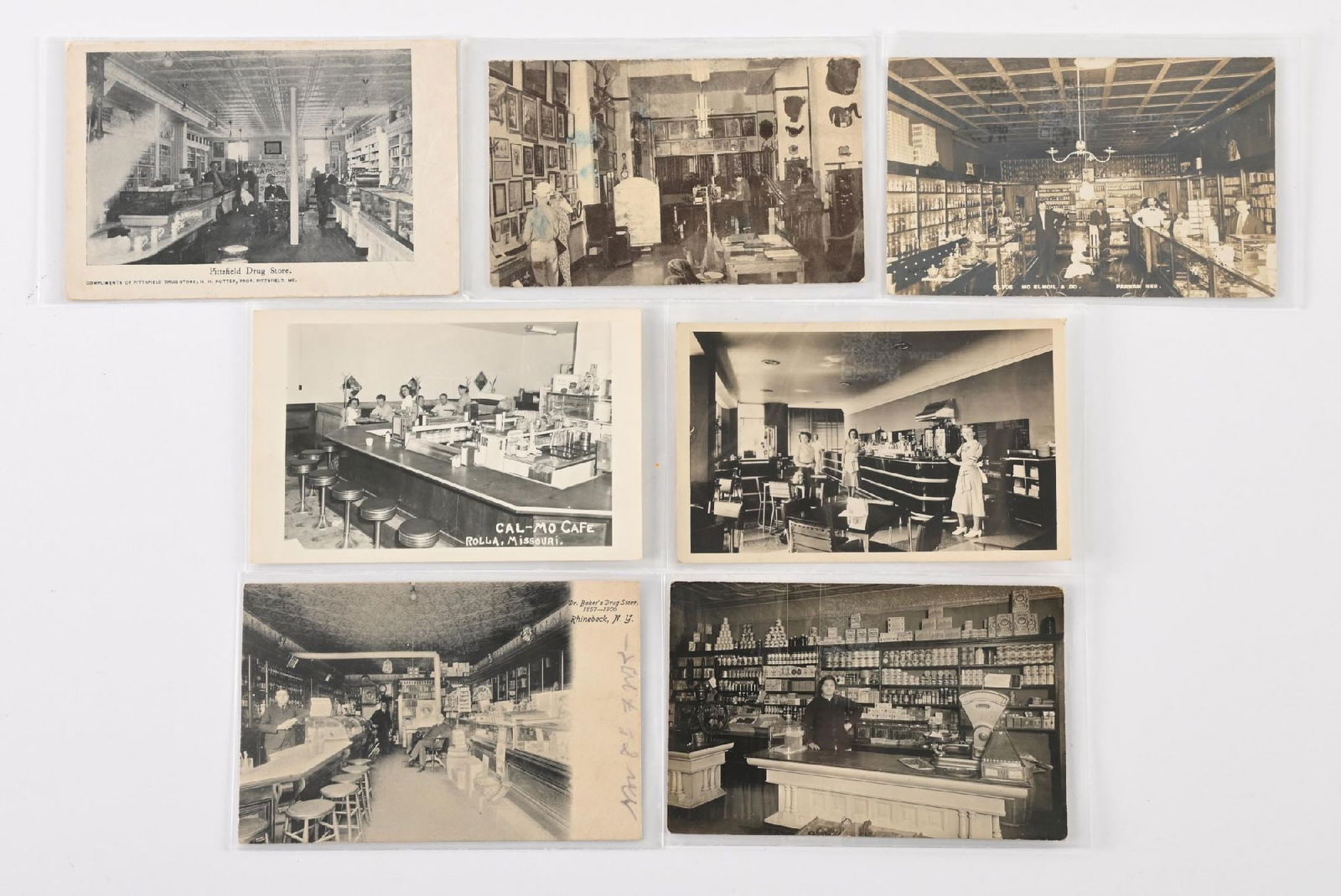 LOT OF 7: VINTAGE BLACK & WHITE STORE FRONTS POSTCARDS (1 of 2)