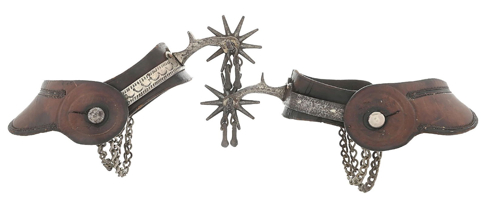BUERMANN SPURS WITH LEATHER-LINED STRAPS: A pair of the early sheet steel leather-lined cowboy spurs offered by August Buermann. Marked with the "PAT'D" and early star. Original leather lining and jingle-bobs still attached. Straps made and s