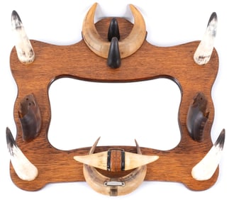 MIRROR WITH HORN ADORNMENT