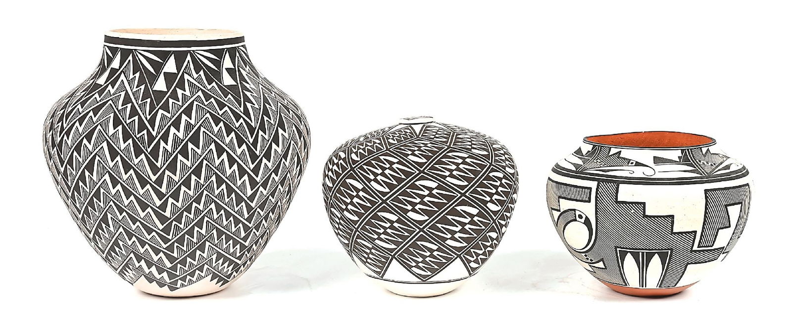 LOT OF 3: ACOMA (ÁAK'U) POTTERY ITEMS: (A) Pottery olla, signed "M Vallo / Acoma, N.M.". With an overall fine line and bold serrated banded pattern. Dimensions: 11 Dia. x 11-1/2" T. (B) Pottery seed jar with lid, signed on base "A. Vallo A